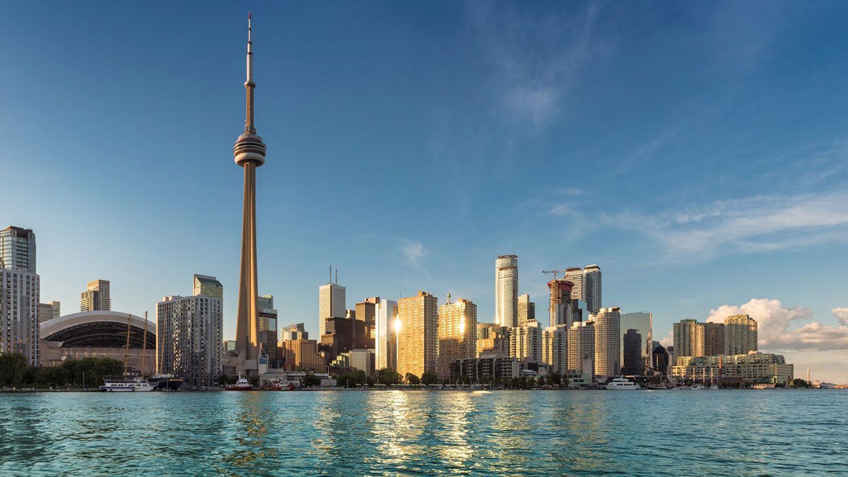 Distant view of Toronto skyline at sunrise